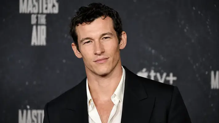 British actor Callum Turner Height displaying his 6 foot 1 frame on the red carpet at the Masters of the Air Apple TV premiere in a black blazer.